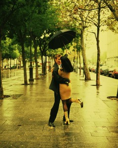 Couple Walking Under Umbrella