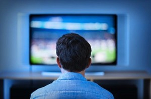 Jersey City, New Jersey, Man watching tv in living room