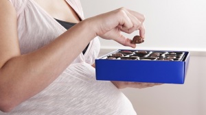 woman-eating-chocolates-while-pregnant